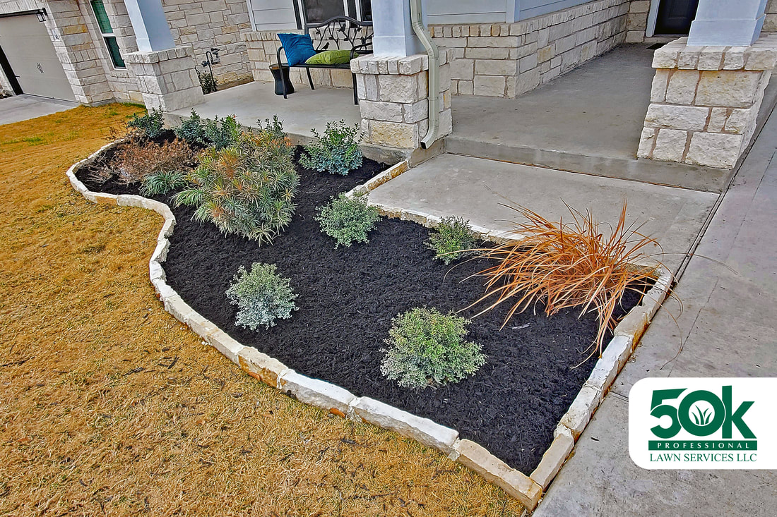 Showcase of quality black mulch in a beautifully landscaped garden in South Austin.